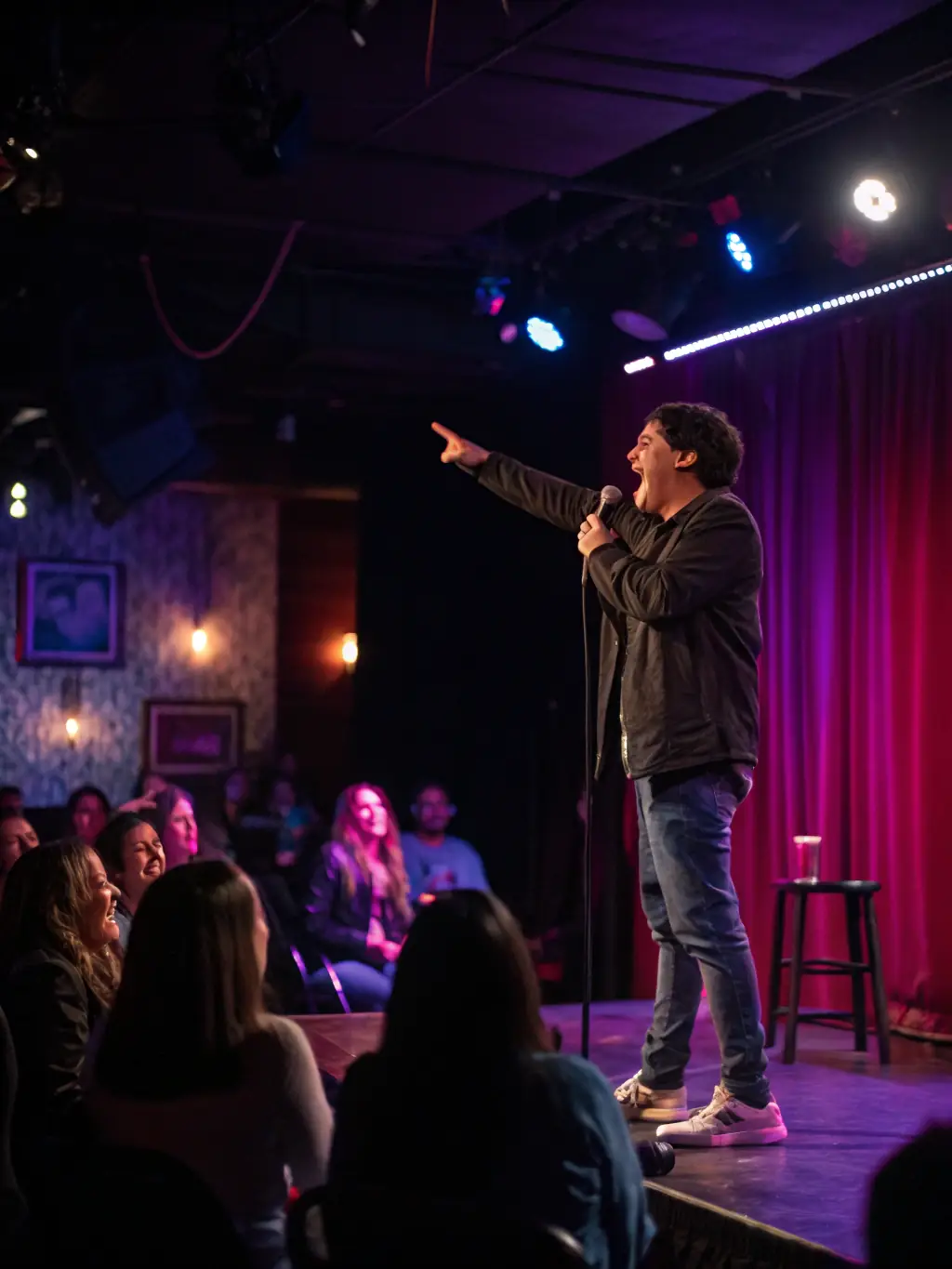 An image promoting 'Comedy Night Live, ' a stand-up comedy show on StreamHub, featuring a comedian on stage with a laughing audience.